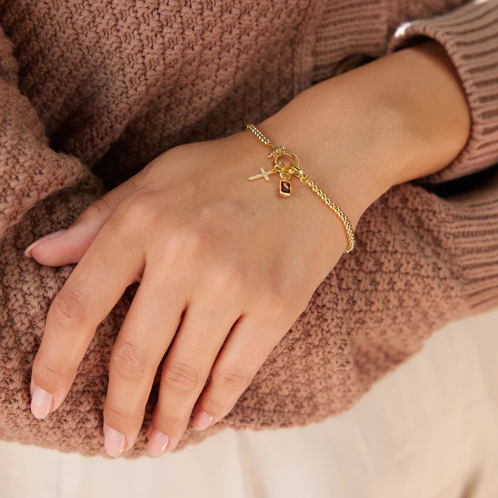 Elegant Beaded Bracelet with Crystal Cross Charm
